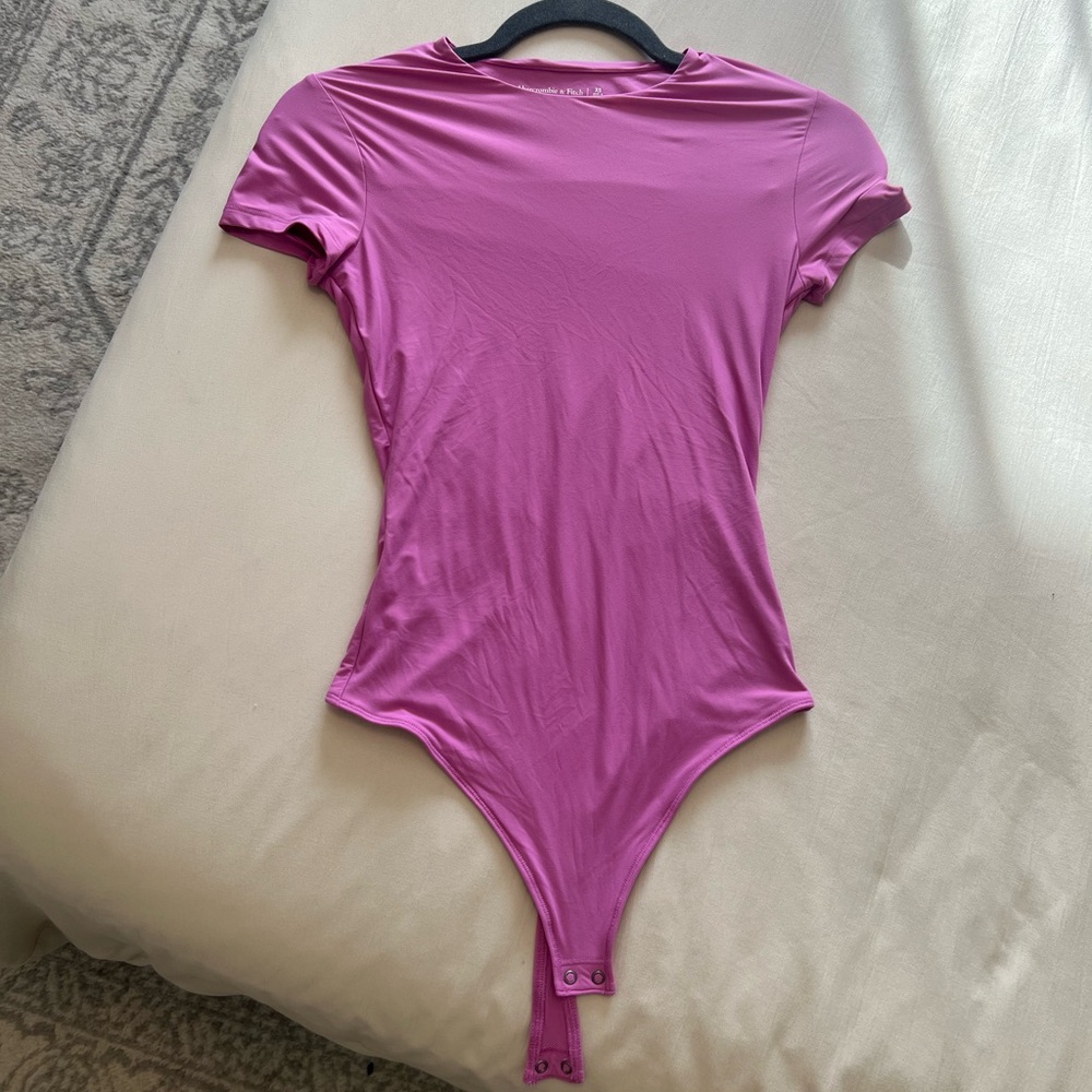 Pinkish purple bodysuit 
Super soft feels like skims